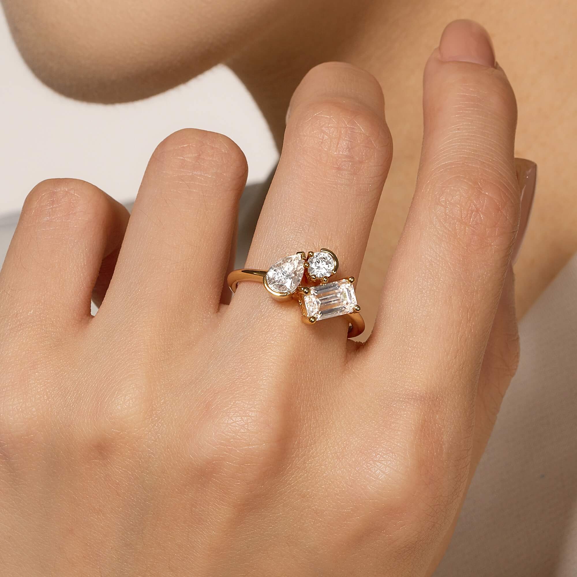 Pear Round Emerald Moissanite Three-Stone Ring - Image 10