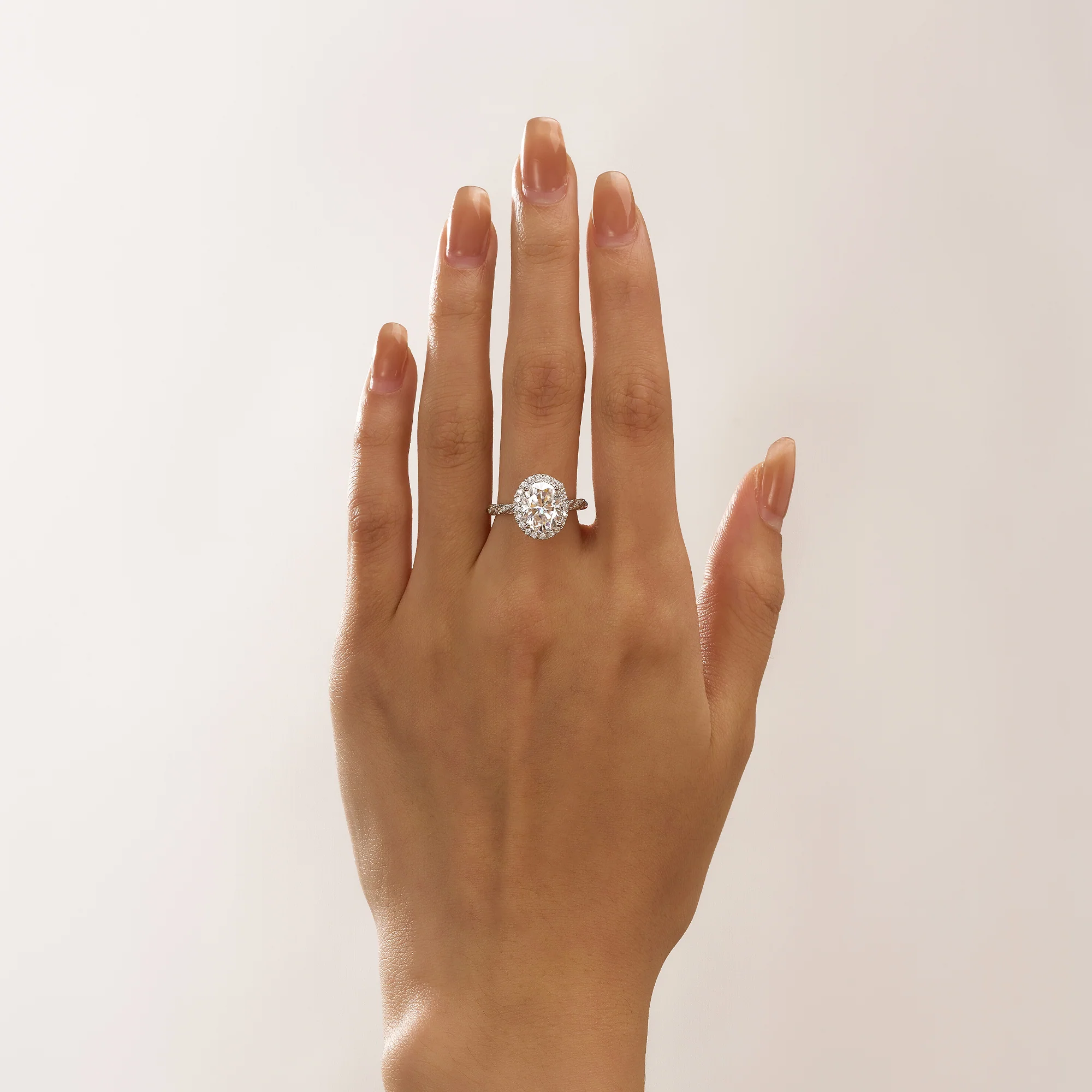Oval Halo Moissanite Engagement Ring with Twisted Pavé Band - Image 14